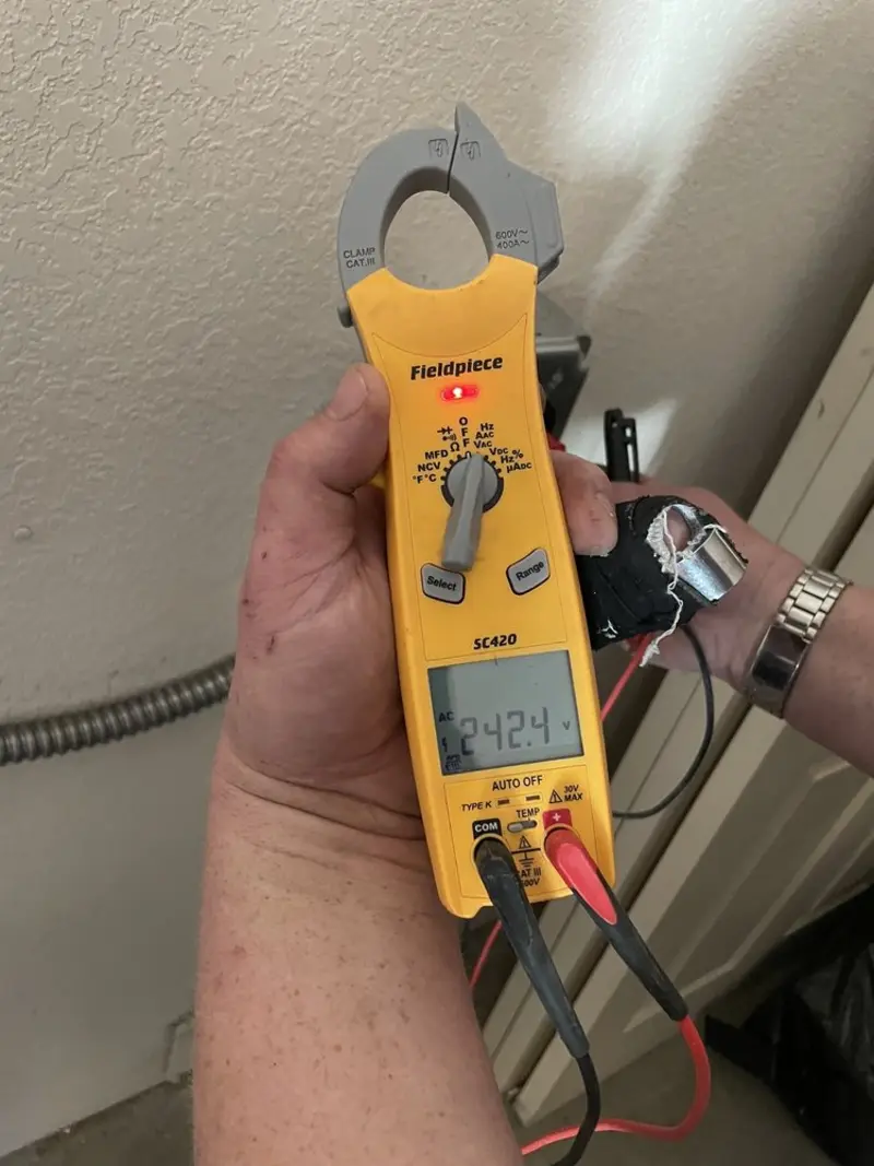 Voltage testing with clamp meter during Whole House Surge Protector in Avon